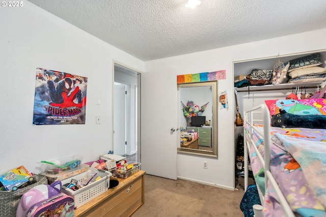 bedroom with light carpet and a textured ceiling