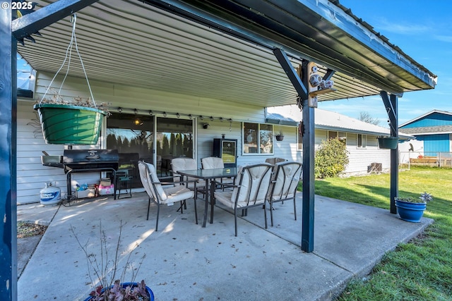 view of patio featuring outdoor dining area