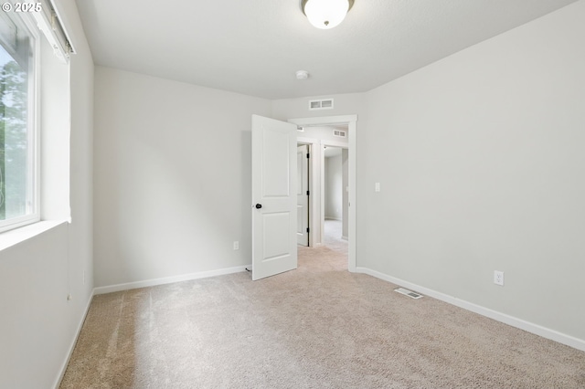 10090 NW Bartlett Loop, North Plains, OR 97133 - unfurnished room featuring light carpet and a smoke detector