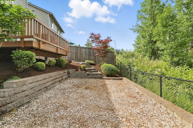 10090 NW Bartlett Loop, North Plains, OR 97133 - fenced backyard with a wooden deck