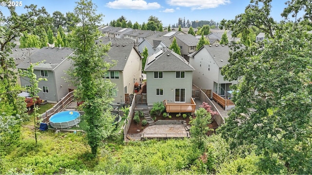 10090 NW Bartlett Loop, North Plains, OR 97133 - rear view of house featuring a residential view and a wooden deck