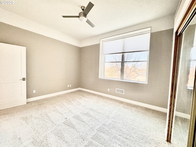 unfurnished bedroom featuring carpet floors and ceiling fan