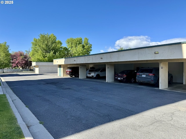 view of front of property featuring a carport