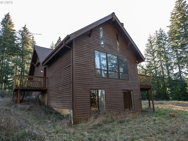 view of side of home featuring a deck