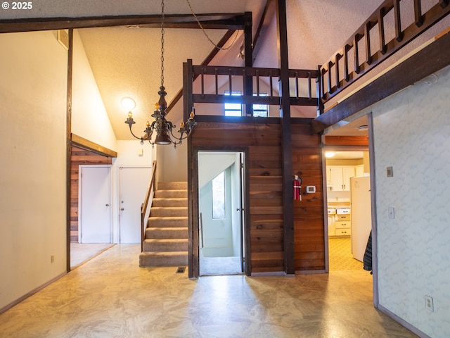 stairs with high vaulted ceiling