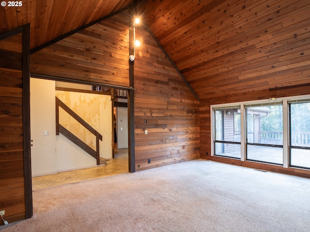 additional living space with high vaulted ceiling, carpet flooring, wooden ceiling, and wooden walls