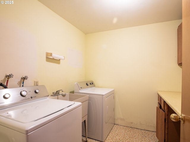 laundry area featuring cabinets and washer and dryer