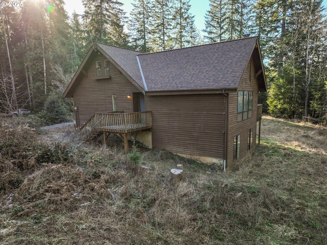 view of home's exterior featuring a deck