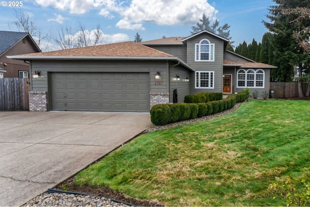 view of front property with a front lawn and a garage