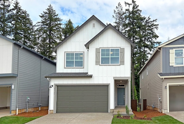 23740 SW Vermillion Dr Unit H182, Tualatin, OR 97062 - view of front facade featuring board and batten siding, an attached garage, and driveway
