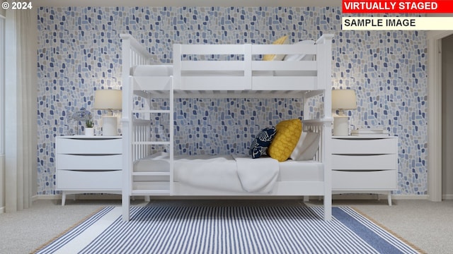 bedroom featuring baseboards and carpet