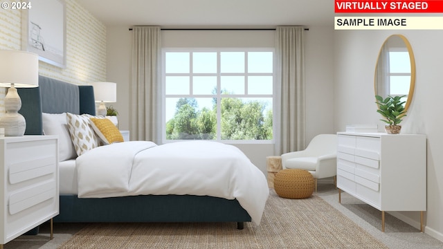 carpeted bedroom with baseboards and multiple windows