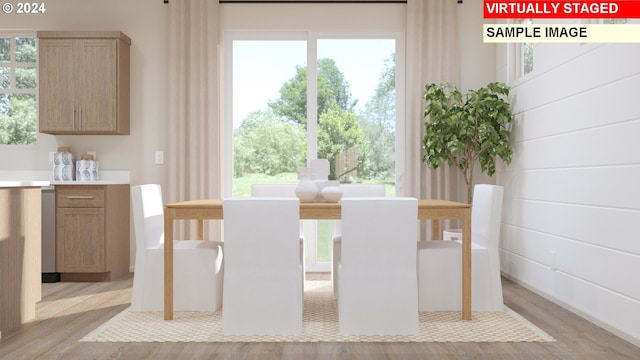 unfurnished dining area with light wood-type flooring