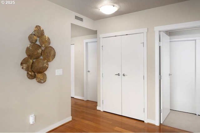 1500 SW 11th Ave Unit 2404, Portland, OR 97201 - corridor with wood finished floors and baseboards