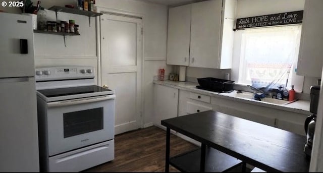 kitchen featuring white cabinetry, white appliances, and dark hardwood / wood-style flooring