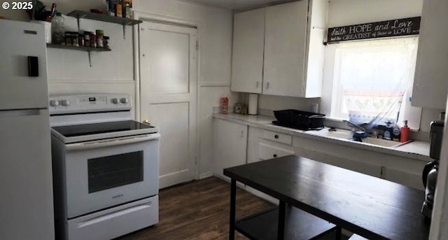 kitchen with sink, white appliances, dark hardwood / wood-style floors, and white cabinets