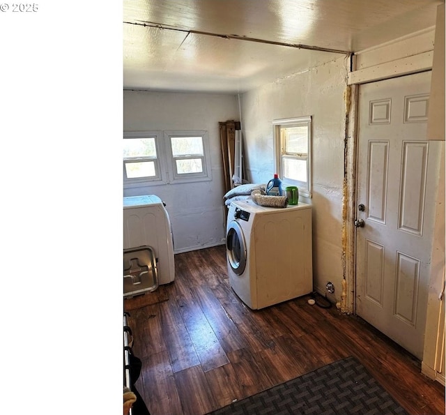 laundry area with dark hardwood / wood-style flooring and independent washer and dryer