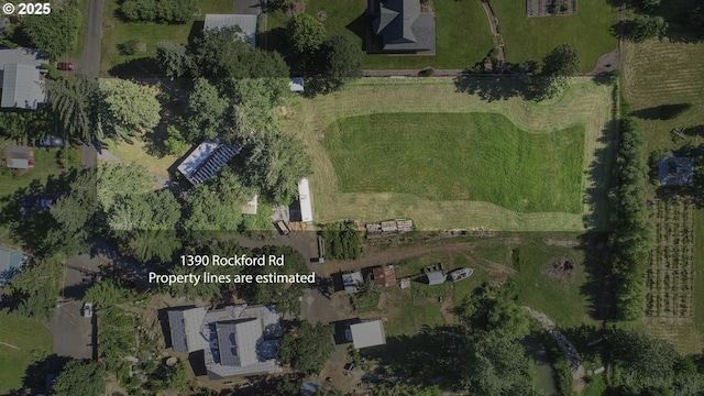 birds eye view of property featuring a rural view