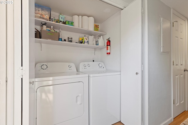 1735 NW Lakeway Ln, Beaverton, OR 97006 - washroom with washing machine and clothes dryer and light wood finished floors