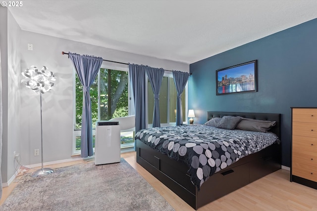 1735 NW Lakeway Ln, Beaverton, OR 97006 - bedroom featuring wood finished floors and baseboards