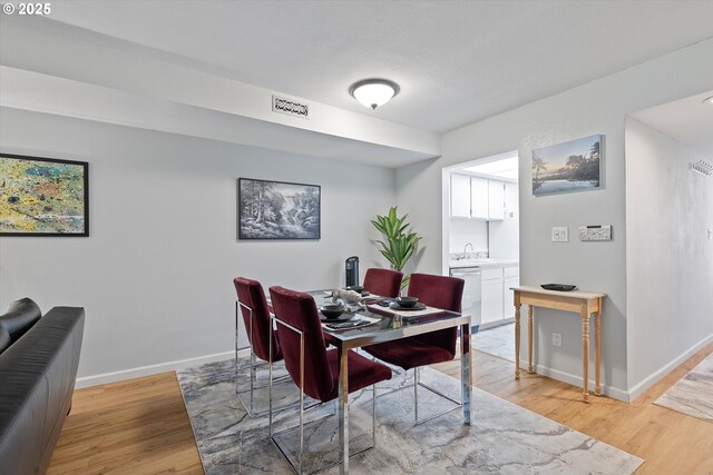 1735 NW Lakeway Ln, Beaverton, OR 97006 - dining area with light wood-type flooring