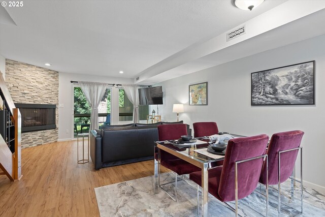 1735 NW Lakeway Ln, Beaverton, OR 97006 - living room featuring wood finished floors, a fireplace, and recessed lighting