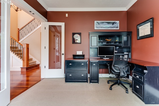 carpeted office featuring crown molding