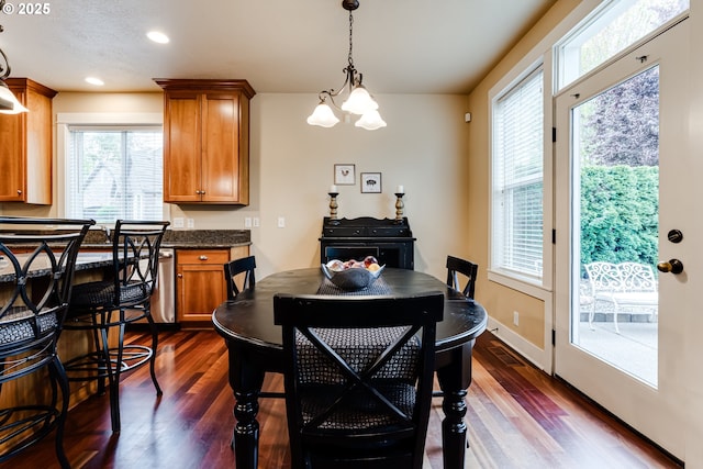 dining room with recessed lighting, a notable chandelier, and dark wood-style floors