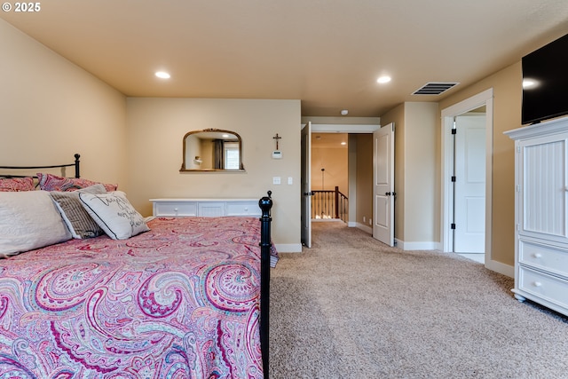bedroom with visible vents, recessed lighting, baseboards, and light carpet