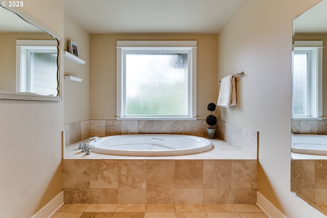 bathroom featuring tile patterned floors and a garden tub