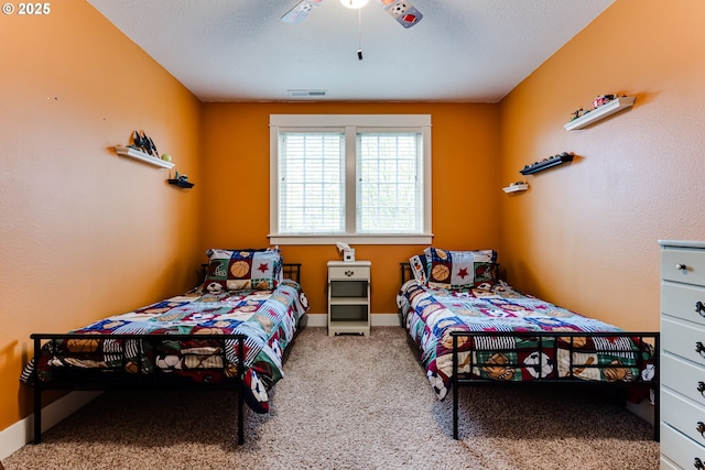 bedroom with carpet floors, baseboards, and visible vents