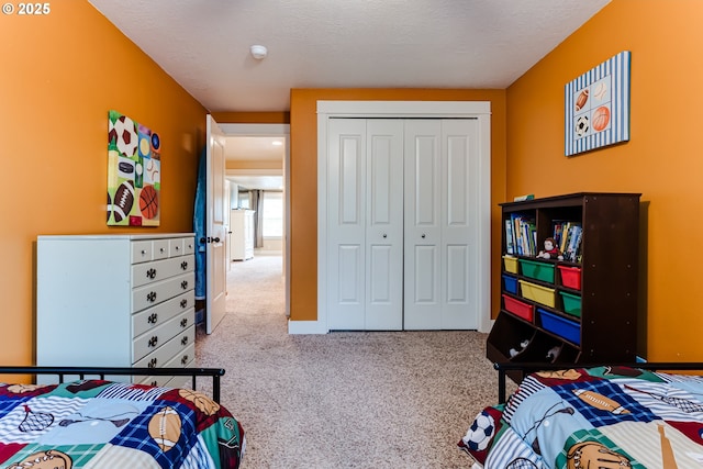 carpeted bedroom with a closet