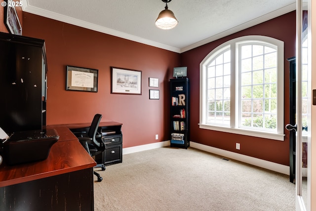 office area featuring crown molding, baseboards, carpet flooring, and visible vents