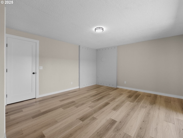 24033 SE Oak St, Gresham, OR 97030 - unfurnished room with light wood-style flooring, a textured ceiling, and baseboards