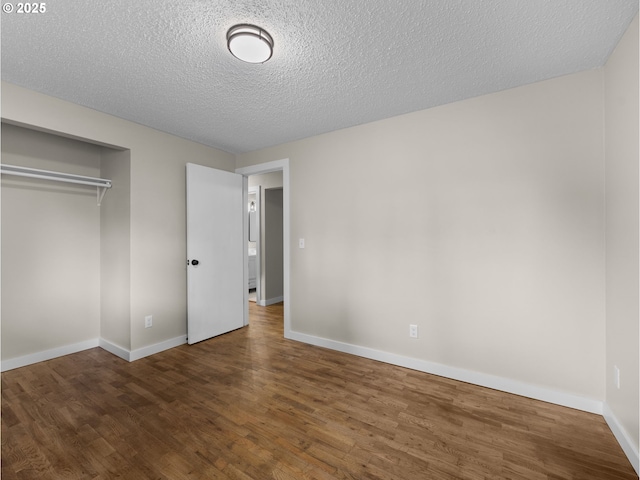 24033 SE Oak St, Gresham, OR 97030 - unfurnished bedroom with wood finished floors, a closet, baseboards, and a textured ceiling