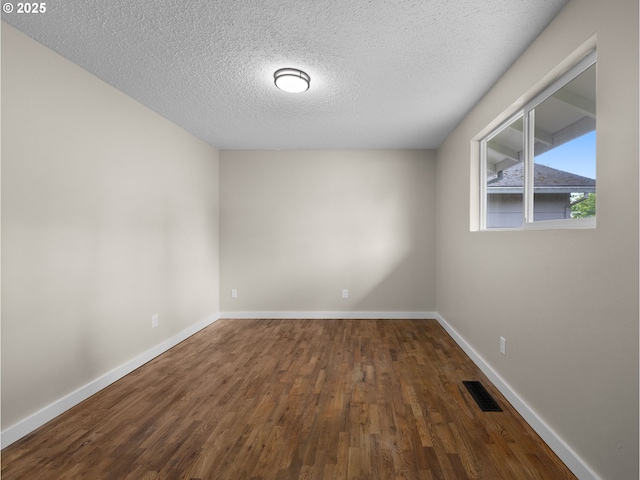 24033 SE Oak St, Gresham, OR 97030 - empty room with a textured ceiling, wood finished floors, and baseboards