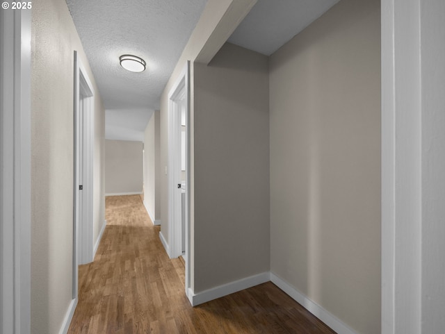 24033 SE Oak St, Gresham, OR 97030 - hall with wood finished floors, baseboards, and a textured ceiling