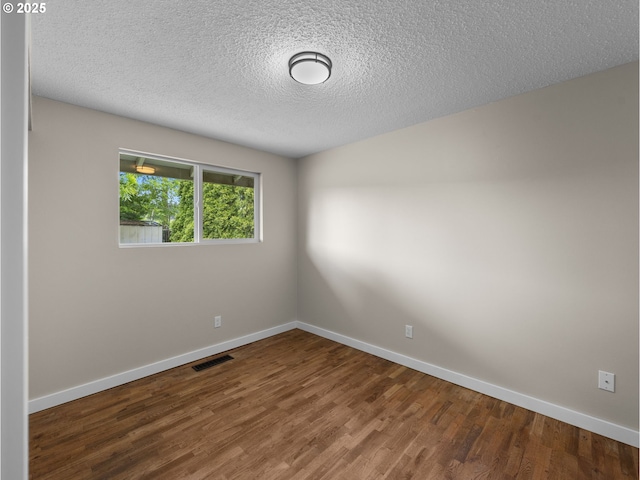 24033 SE Oak St, Gresham, OR 97030 - spare room with wood finished floors, baseboards, and a textured ceiling