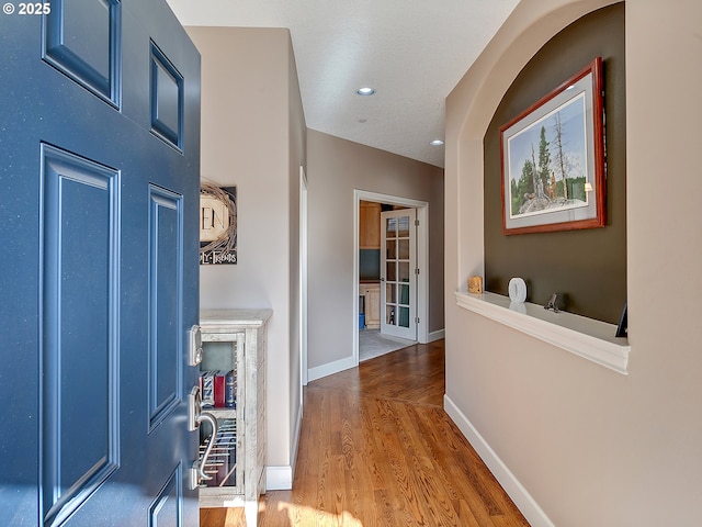 entrance foyer featuring recessed lighting, baseboards, and wood finished floors