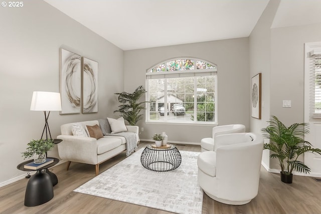 sitting room with wood-type flooring