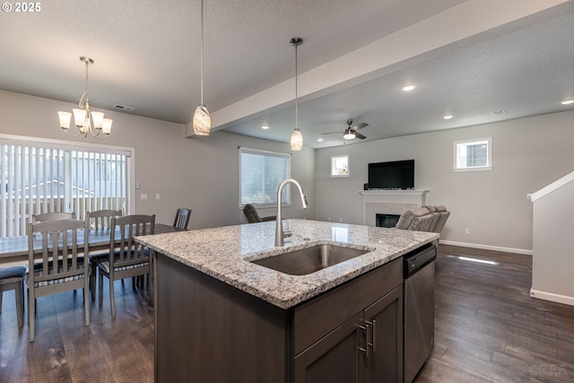 46 Shore Dr, Saint Helens, OR 97051 - kitchen with stainless steel dishwasher, baseboards, a sink, ceiling fan with notable chandelier, and a fireplace
