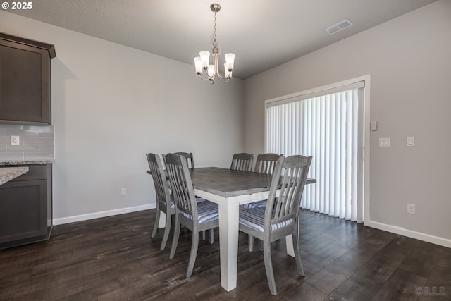 46 Shore Dr, Saint Helens, OR 97051 - dining space featuring baseboards, a notable chandelier, visible vents, and dark wood-style floors