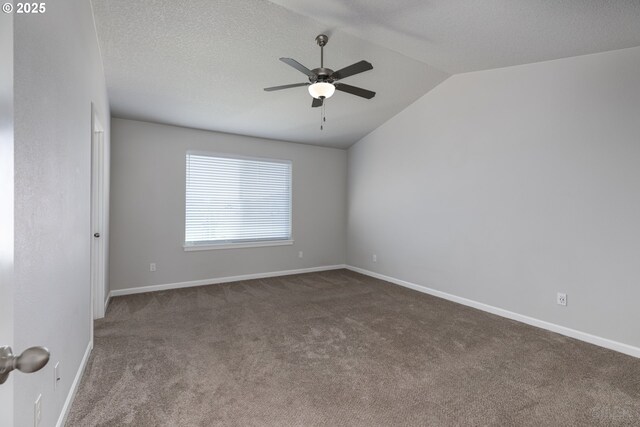 46 Shore Dr, Saint Helens, OR 97051 - spare room featuring lofted ceiling, baseboards, ceiling fan, and carpet floors