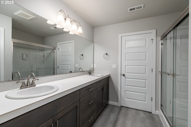 46 Shore Dr, Saint Helens, OR 97051 - full bath featuring visible vents, wood finished floors, a stall shower, and a sink