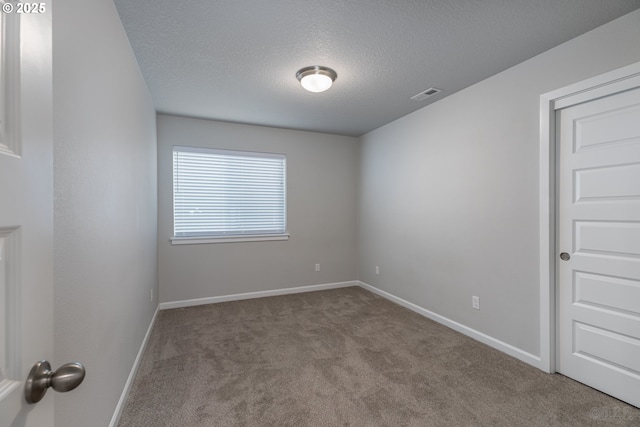 46 Shore Dr, Saint Helens, OR 97051 - spare room with a textured ceiling, visible vents, baseboards, and carpet floors