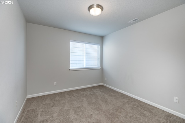 46 Shore Dr, Saint Helens, OR 97051 - spare room featuring carpet, visible vents, and baseboards