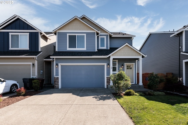 46 Shore Dr, Saint Helens, OR 97051 - view of front of house featuring an attached garage, stone siding, a shingled roof, a front lawn, and driveway