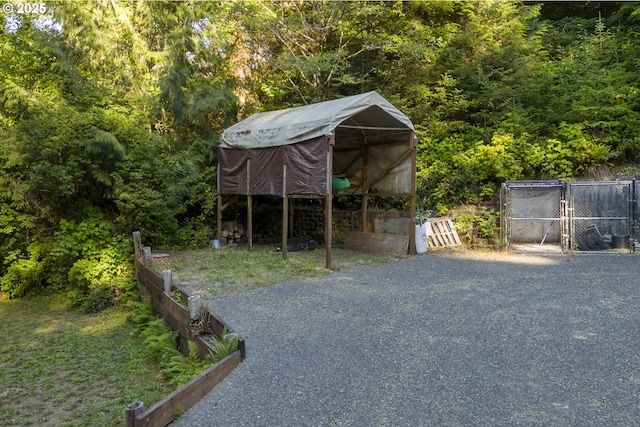 594 NE Newport Heights Dr, Newport, OR 97365 - view of outbuilding with an outbuilding and fence