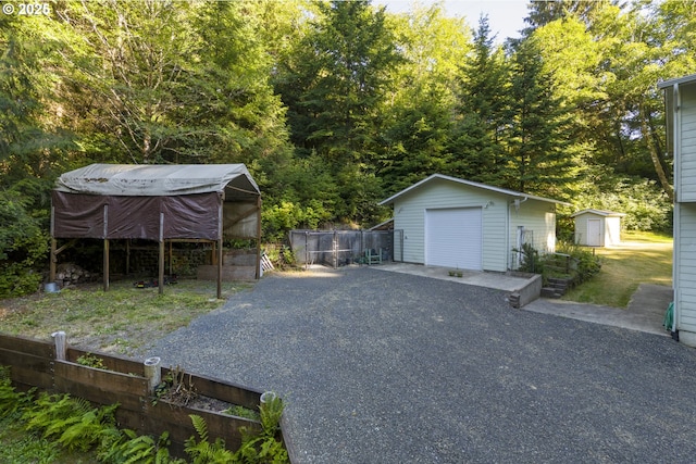 594 NE Newport Heights Dr, Newport, OR 97365 - detached garage featuring fence and a storage shed