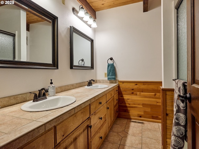 bathroom with vanity, tile patterned flooring, wooden walls, and wooden ceiling